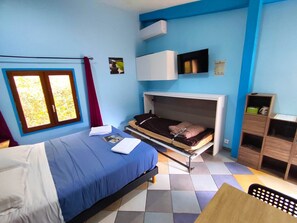Chambre avec lit d'appoint