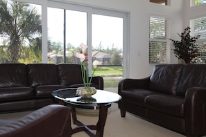 Casual sitting room looking out onto the lanai