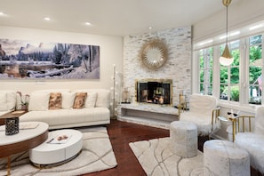Lovely living area with gas fireplace, Peter Lik artwork