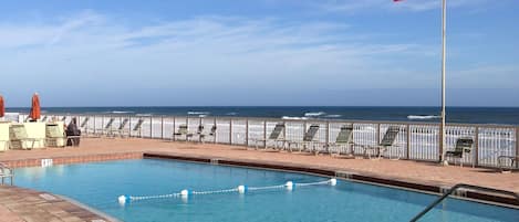 Large saltwater pool is heated and adjacent to the beach.