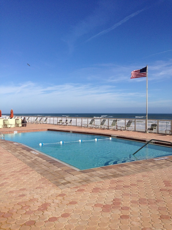 Large saltwater pool is heated and adjacent to the beach.