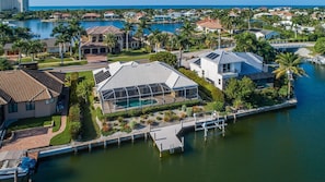 Aerial view of waterfront pool dock and bay