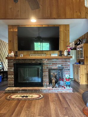 65 inch 4K T.V. with gorgeous fireplace (wood is provided at the front door).