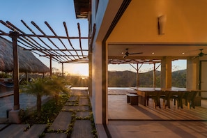 Slide open the walls and let the sunset and breezes flow through house