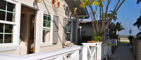 View past the cottage to the beach on the bay.