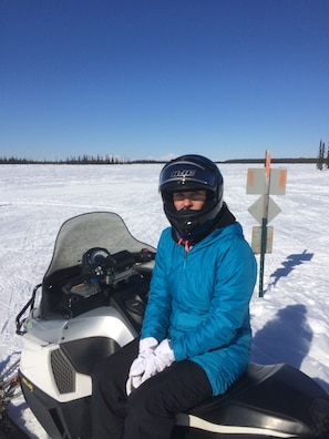 Beautiful day on the snowmobile trails. Then drive back to your warm cottage.