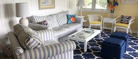 Living room with queen sleeper sofa and overstuffed chair