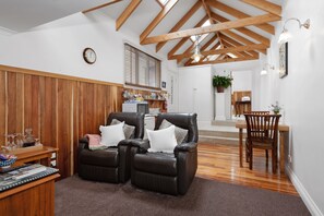 Ellie's Spa Cottage sitting room area with leather recliners, TV and DVD player.