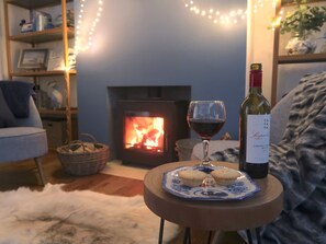 Cosy up by the fire at Bell Lodge