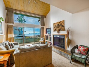 wood burning fireplace-comfy living space and a view