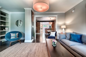 open floor plan with exposed brick