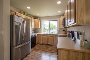 Fully stocked kitchen ready for you to prepare your meals. 