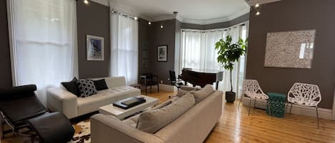 Sophisticated Living Room With Baby Grand Piano