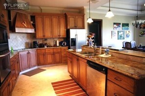 Gourmet kitchen.  Granite. Adjacent wet bar provides 2nd sink