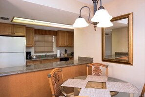 Enjoy your meals at the dining table with seating.