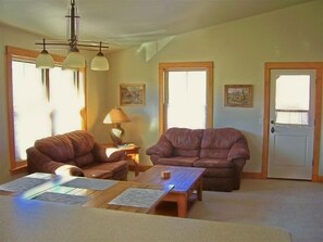 The large, open great room and vaulted ceilings provide a light and airy feel to these spacious living quarters.