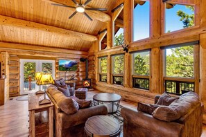 Soaring ponderosa and white pine log architecture amid sweeping views