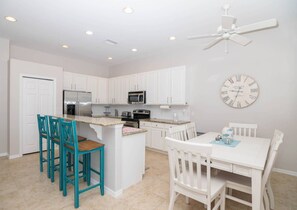 The Kitchen of the Home Has Stainless Steel Appliances and Granite Counter Tops.