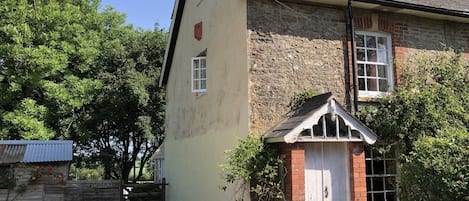 My darling cottage with its large parking area; twice the width.  