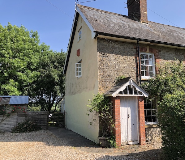 My darling cottage with its large parking area; twice the width.  