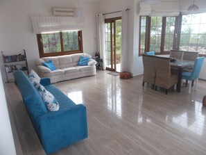 Open plan lounge/dining area with sea views. 