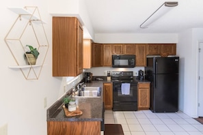 The Kitchen is fully stocked. It has plates, cutlery, cups, wine glasses, pans, knives . . . and all the essentials for a home-cooked meal. We even have a dishwasher that you can start your dirty dishes in as you leave. We can take care of the rest!