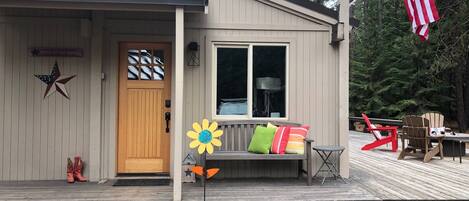 Our darling home has a large front deck and private back deck.