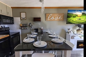 The kitchen island, with seating for eight people, is a great place to gather with your group for meals!