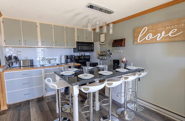 Welcome to Mountain Lodge 125, featuring a kitchen island that accommodates eight people.