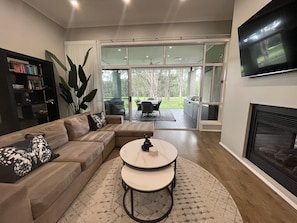 Comfy family room with gas log fireplace and big screen TV