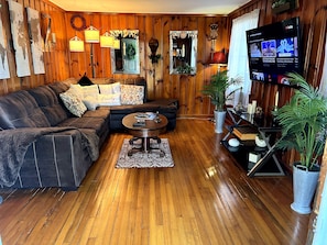 Solid wood living room. Feels like being on a wood ship, lots of nautical refer.