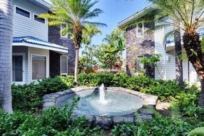 Soothing fountain at your doorstep.  Fountains add to the condo tropical feeling