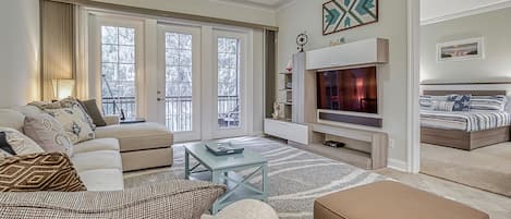 Living Room with Media Center and Screened Lanai Access