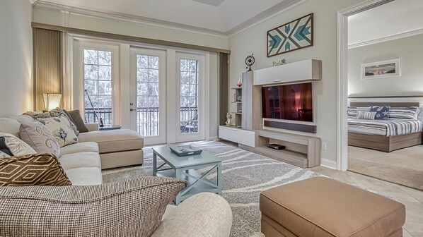 Living Room with Media Center and Screened Lanai Access