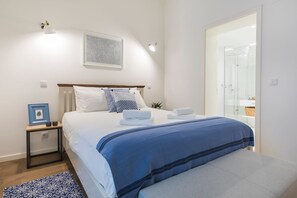 The master bedroom has an en suite bathroom