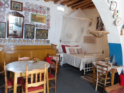 The Swallows' Nest:-Traditional Greek house with soaring central arch, and lofts