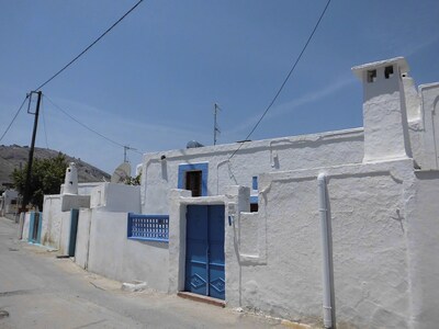The Swallows' Nest:-Traditional Greek house with soaring central arch, and lofts