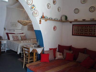 The Swallows' Nest:-Traditional Greek house with soaring central arch, and lofts