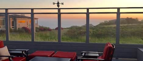 The deck is surrounded by glass walls to allow you to enjoy the view while blocking the wind.