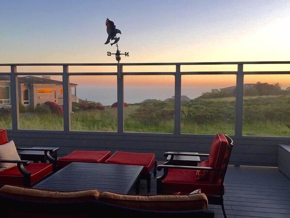 The deck is surrounded by glass walls to allow you to enjoy the view while blocking the wind.