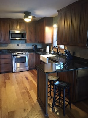 Fully equipped modern kitchen with farmhouse sink