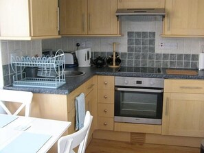 Kitchen - Fully equipped, inc. cooker, hob, dishwasher and fridge with ice box.