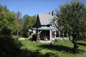 A side view captures a deck off the kitchen, perfect for bbq and outdoor meals