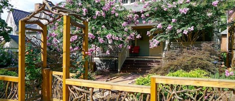 View of the Cozy Cottage in Spring with artfully designed Mountain Laurel Fence.