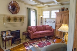 Living room with 2 comfortable sofas (1 pull out) and overstuffed chair.