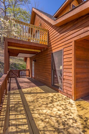 corner of wrap around porch showing balcony off of loft.