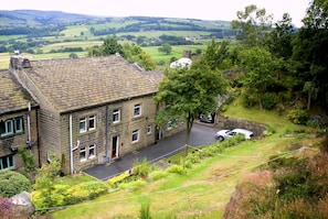 Set in two acres of woodland wildlife garden, with extensive Pennine views 