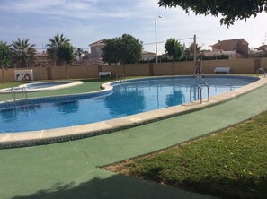 Communal pool ..take a plunge..seating ..shaded areas .. well kept greenery 