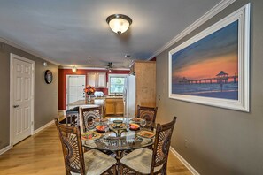 Gather around the dining table to enjoy meals.