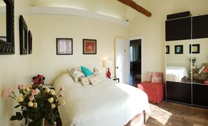 Bedroom 1: Queen bed with mirrored amoir closet